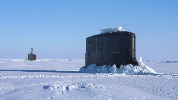 The Seawolf-class fast-attack submarine USS Connecticut and the Los Angeles-class fast-attack submarine USS Hartford break through the ice in the Beaufort Sea Saturday, March 10, 2018 in support of Ice Exercise (ICEX) 2018. - Sputnik International