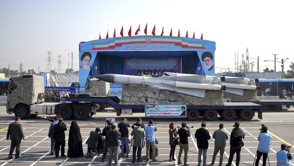 In front of the portraits of supreme leader Ayatollah Ali Khamenei, right, and the late revolutionary founder Ayatollah Khomeini, left, a missile is displayed by Iran's army during a parade marking National Army Day at the mausoleum of Khomeini, just outside Tehran, Iran, Wednesday, April 18, 2018. - Sputnik International