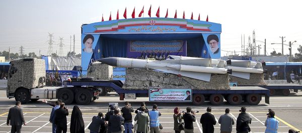 In front of the portraits of supreme leader Ayatollah Ali Khamenei, right, and the late revolutionary founder Ayatollah Khomeini, left, a missile is displayed by Iran's army during a parade marking National Army Day at the mausoleum of Khomeini, just outside Tehran, Iran, Wednesday, April 18, 2018. In front of the portraits of supreme leader Ayatollah Ali Khamenei, right, and the late revolutionary founder Ayatollah Khomeini, left, a missile is displayed by Iran's army during a parade marking National Army Day at the mausoleum of Khomeini, just outside Tehran, Iran, Wednesday, April 18, 2018. - Sputnik International