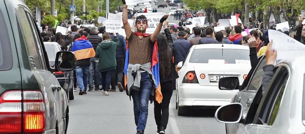A participant in a protest rally against the election of former President Serzh Sargsyan as prime minister of Armenia in Yerevan A participant in a protest rally against the election of former President Serzh Sargsyan as prime minister of Armenia in Yerevan - Sputnik International