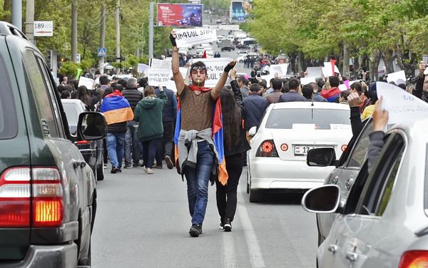 A participant in a protest rally against the election of former President Serzh Sargsyan as prime minister of Armenia in Yerevan A participant in a protest rally against the election of former President Serzh Sargsyan as prime minister of Armenia in Yerevan - Sputnik International
