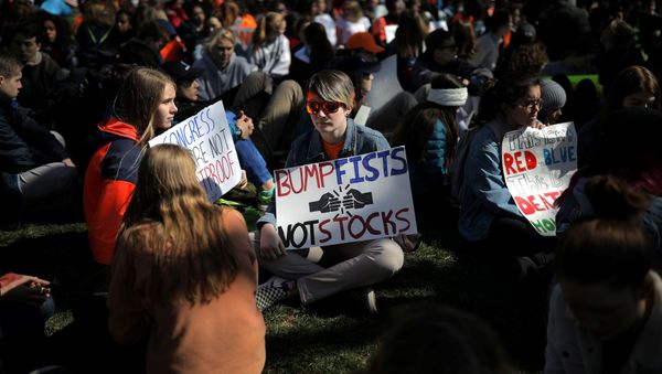 Students attend a rally outside the White House as part of nationwide walk-outs of classes to mark the 19th anniversary since the Columbine High School mass shooting, at Lafayette park in Washington, D.C., U.S Students attend a rally outside the White House as part of nationwide walk-outs of classes to mark the 19th anniversary since the Columbine High School mass shooting, at Lafayette park in Washington, D.C., U.S - Sputnik International