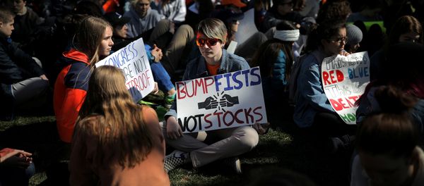 Students attend a rally outside the White House as part of nationwide walk-outs of classes to mark the 19th anniversary since the Columbine High School mass shooting, at Lafayette park in Washington, D.C., U.S - Sputnik International