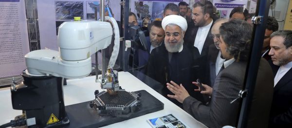 In this photo released by an official website of the office of the Iranian Presidency, President Hassan Rouhani listens to explanations on new nuclear achievements at a ceremony to mark National Nuclear Day, in Tehran, Iran, Monday, April 9, 2018 In this photo released by an official website of the office of the Iranian Presidency, President Hassan Rouhani listens to explanations on new nuclear achievements at a ceremony to mark National Nuclear Day, in Tehran, Iran, Monday, April 9, 2018 - Sputnik International