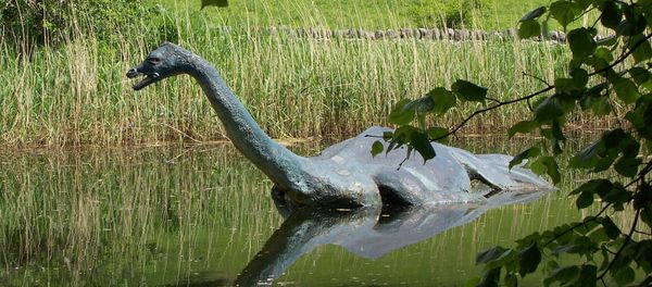 In this June 2006 file photo a model monster replica of the legendary sea serpent of Loch Ness, Nessie, provides a photo op for visitors in Drumnadrochit, Scotland - Sputnik International