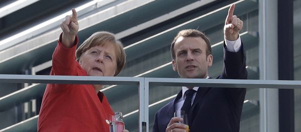 French President Emmanuel Macron, right, and German Chancellor Angela Merkel take a break on a balcony of Merkel's office after a meeting in the chancellery in Berlin, Germany, Thursday, April 19, 2018 French President Emmanuel Macron, right, and German Chancellor Angela Merkel take a break on a balcony of Merkel's office after a meeting in the chancellery in Berlin, Germany, Thursday, April 19, 2018 - Sputnik International