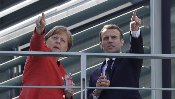 French President Emmanuel Macron, right, and German Chancellor Angela Merkel take a break on a balcony of Merkel's office after a meeting in the chancellery in Berlin, Germany, Thursday, April 19, 2018 French President Emmanuel Macron, right, and German Chancellor Angela Merkel take a break on a balcony of Merkel's office after a meeting in the chancellery in Berlin, Germany, Thursday, April 19, 2018 - Sputnik International