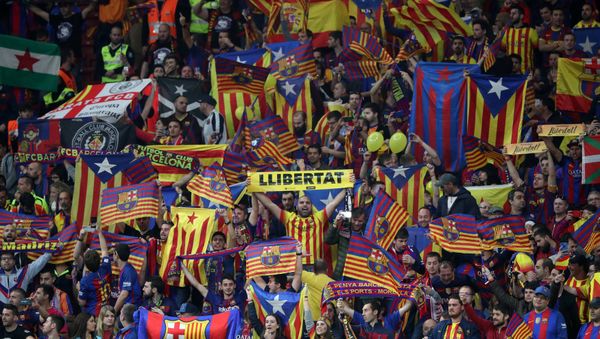 Soccer Football - Spanish King's Cup Final - FC Barcelona v Sevilla - Wanda Metropolitano, Madrid, Spain - April 21, 2018 Barcelona fan holds up a Llibertat banner before the match as Catalan and Catalan separatist flags are displayed - Sputnik International