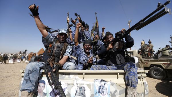 Houthi fighters chant slogans as they ride a military vehicle during a gathering in the capital Sanaa to mobilize more fighters to battlefronts to fight pro-government forces in several Yemeni cities (File) - Sputnik International