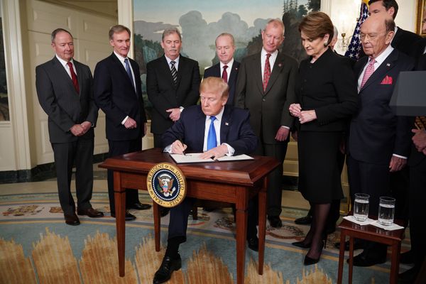US President Donald Trump signs trade sanctions against China on March 22, 2018, in the Diplomatic Reception Room of the White House in Washington, DC, on March 22, 2018. Trump will impose tariffs on about $50 billion in Chinese goods imports to retaliate against the alleged theft of American intellectual property, White House officials said Thursday - Sputnik International