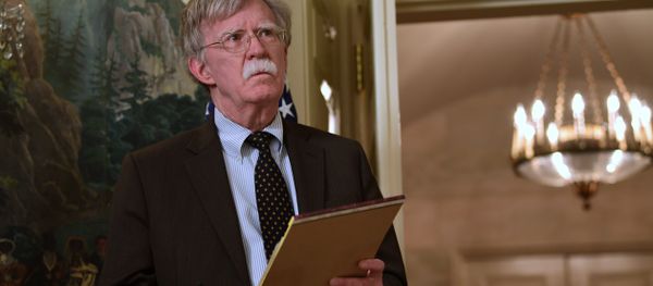 National security adviser John Bolton listens President Donald Trump speaks in the Diplomatic Reception Room of the White House on Friday, April 13, 2018, in Washington, about the United States' military response to Syria's chemical weapon attack on April 7 National security adviser John Bolton listens President Donald Trump speaks in the Diplomatic Reception Room of the White House on Friday, April 13, 2018, in Washington, about the United States' military response to Syria's chemical weapon attack on April 7 - Sputnik International