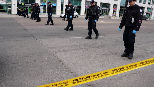 Police officers comb a street for evidence after a van struck multiple people along a major intersection in north Toronto, Ontario, Canada, April 24, 2018. Police officers comb a street for evidence after a van struck multiple people along a major intersection in north Toronto, Ontario, Canada, April 24, 2018. - Sputnik International