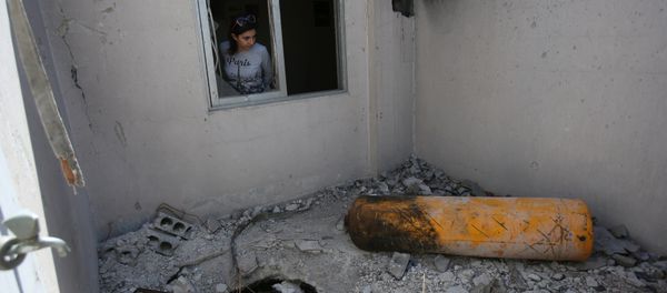A journalist looks on during a media tour of a damaged house where Organisation for the Prohibition of Chemical Weapons (OPCW) inspectors are belived to have visited in Douma near Damascus, Syria April 23, 2018 A journalist looks on during a media tour of a damaged house where Organisation for the Prohibition of Chemical Weapons (OPCW) inspectors are belived to have visited in Douma near Damascus, Syria April 23, 2018 - Sputnik International