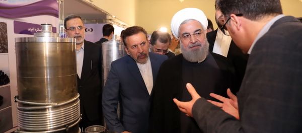 President Hassan Rouhani listens to explanations on new nuclear achievements at a ceremony to mark National Nuclear Day, in Tehran, Iran, Monday, April 9, 2018 President Hassan Rouhani listens to explanations on new nuclear achievements at a ceremony to mark National Nuclear Day, in Tehran, Iran, Monday, April 9, 2018 - Sputnik International