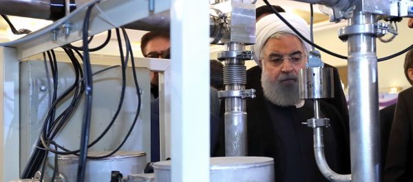 President Hassan Rouhani listens to explanations on new nuclear achievements at a ceremony to mark National Nuclear Day, in Tehran, Iran, Monday, April 9, 2018 President Hassan Rouhani listens to explanations on new nuclear achievements at a ceremony to mark National Nuclear Day, in Tehran, Iran, Monday, April 9, 2018 - Sputnik International