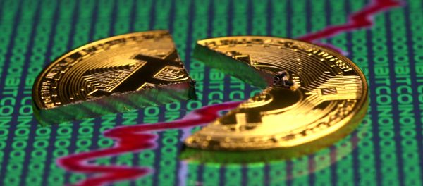Broken representation of the Bitcoin virtual currency, placed on a monitor that displays stock graph and binary codes, are seen in this illustration picture, December 21, 2017 Broken representation of the Bitcoin virtual currency, placed on a monitor that displays stock graph and binary codes, are seen in this illustration picture, December 21, 2017 - Sputnik International