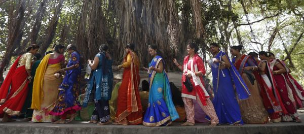 (File) Indian Hindu married women tie cotton threads around a Banyan tree as they perform rituals on the first day of Vat Savitri festival in Ahmadabad, India, Tuesday, June 6, 2017 (File) Indian Hindu married women tie cotton threads around a Banyan tree as they perform rituals on the first day of Vat Savitri festival in Ahmadabad, India, Tuesday, June 6, 2017 - Sputnik International