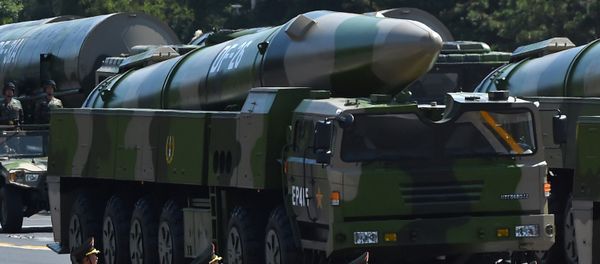 Military vehicles carrying DF-26 ballistic missiles participate in a military parade at Tiananmen Square in Beijing on September 3, 2015, to mark the 70th anniversary of victory over Japan and the end of World War II Military vehicles carrying DF-26 ballistic missiles participate in a military parade at Tiananmen Square in Beijing on September 3, 2015, to mark the 70th anniversary of victory over Japan and the end of World War II - Sputnik International
