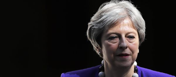 Britain's Prime Minister Theresa May leaves 10 Downing Street in central London on April 18, 2018, as she heads to the weekly Prime Minister's Questions (PMQs) session in the House of Commons. Britain's Prime Minister Theresa May leaves 10 Downing Street in central London on April 18, 2018, as she heads to the weekly Prime Minister's Questions (PMQs) session in the House of Commons. - Sputnik International