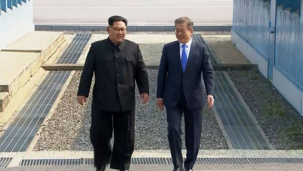 In this image taken from video provided by Korea Broadcasting System (KBS) Friday, April 27, 2018, North Korean leader Kim Jong Un, left, and South Korean President Moon Jae-in walk together as Kim crossed the border into South Korea for their historic face-to-face talks, in Panmunjom. In this image taken from video provided by Korea Broadcasting System (KBS) Friday, April 27, 2018, North Korean leader Kim Jong Un, left, and South Korean President Moon Jae-in walk together as Kim crossed the border into South Korea for their historic face-to-face talks, in Panmunjom. - Sputnik International