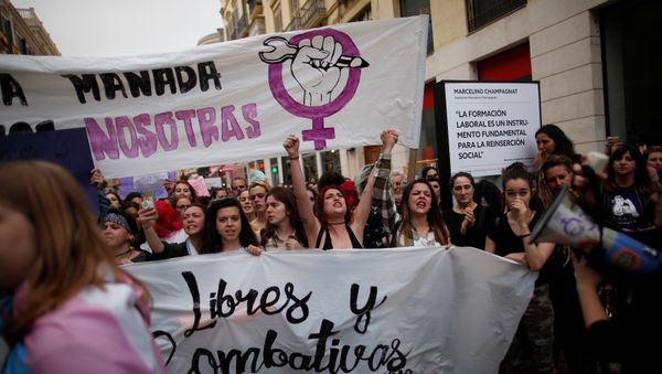 People shout slogans during a protest after a Spanish court condemned five men accused of the group rape of an 18-year-old woman at the 2016 San Fermin bull running festival to nine years in prison each for the lesser crime of sexual abuse in Malaga, Spain, April 26, 2018 People shout slogans during a protest after a Spanish court condemned five men accused of the group rape of an 18-year-old woman at the 2016 San Fermin bull running festival to nine years in prison each for the lesser crime of sexual abuse in Malaga, Spain, April 26, 2018 - Sputnik International