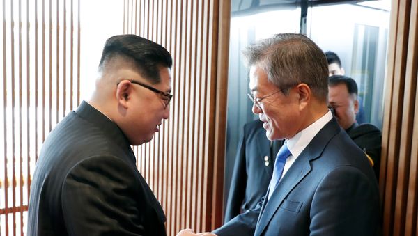 South Korean President Moon Jae-in shakes hands with North Korean leader Kim Jong Un at the truce village of Panmunjom inside the demilitarized zone separating the two Koreas, South Korea, April 27, 2018 South Korean President Moon Jae-in shakes hands with North Korean leader Kim Jong Un at the truce village of Panmunjom inside the demilitarized zone separating the two Koreas, South Korea, April 27, 2018 - Sputnik International
