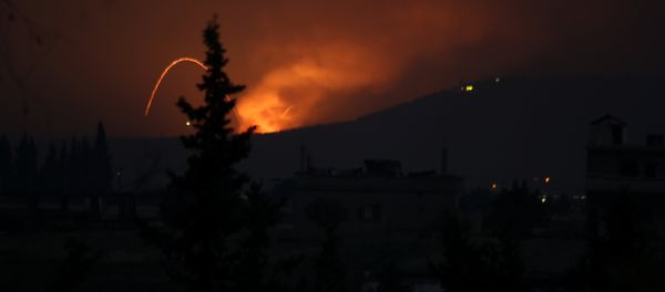 Fire and explosions are seen in what purported to be the Mountain 47 region, countryside south of Hama city, Syria, April 29, 2018 in this picture obtained from social media - Sputnik International