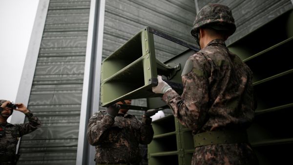 South Korean soldiers dismantle loudspeakers that were set up for propaganda broadcasts near the demilitarized zone separating the two Koreas in Paju, South Korea, May 1, 2018. South Korean soldiers dismantle loudspeakers that were set up for propaganda broadcasts near the demilitarized zone separating the two Koreas in Paju, South Korea, May 1, 2018. - Sputnik International