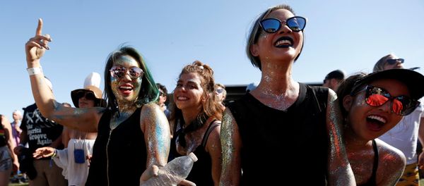Concertgoers dance during a performance by Nile Rodgers at the Coachella Valley Music and Arts Festival in Indio, California, U.S., April 14, 2018 Concertgoers dance during a performance by Nile Rodgers at the Coachella Valley Music and Arts Festival in Indio, California, U.S., April 14, 2018 - Sputnik International