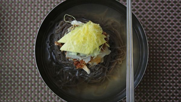 In this Friday, June 16, 2017, photo, a bowl of Naengmyeon or cold buckwheat noodles, popular among North Koreans, is served in a restaurant in Pyongyang, North Korea In this Friday, June 16, 2017, photo, a bowl of Naengmyeon or cold buckwheat noodles, popular among North Koreans, is served in a restaurant in Pyongyang, North Korea - Sputnik International