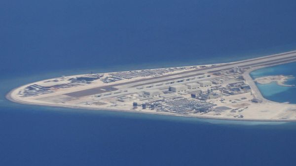 Chinese structures and an airstrip on the man-made Subi Reef at the Spratly group of islands in the South China Sea are seen from a Philippine Air Force C-130 transport plane of the Philippine Air Force, Friday, April 21, 2017 - Sputnik International