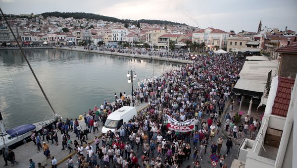 Locals take part in a protest against the visit of Greek Prime Minister Alexis Tsipras in Mytilene, on the Greek island of Lesbos, May 3, 2018 - Sputnik International