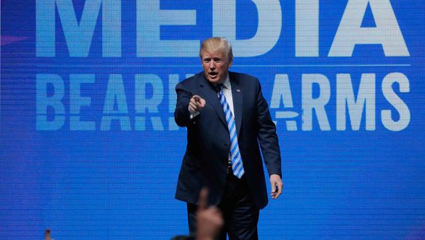 U.S. President Donald Trump gestures after speaking at a National Rifle Association (NRA) convention in Dallas, Texas, U.S. May 4, 2018 - Sputnik International