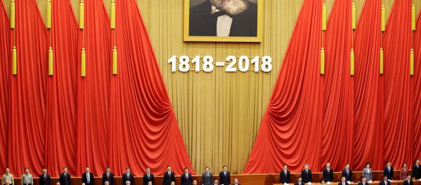 Chinese President Xi Jinping and other officials sing the national anthem at an event commemorating the 200th birth anniversary of Karl Marx, in Beijing, China May 4, 2018 - Sputnik International