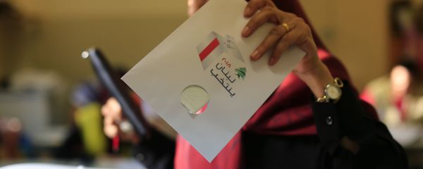 A Lebanese woman casts a ballot at a polling station during the Lebanon's parliamentary elections in a southern suburb of Beirut, Lebanon, Sunday, May 6, 2018 A Lebanese woman casts a ballot at a polling station during the Lebanon's parliamentary elections in a southern suburb of Beirut, Lebanon, Sunday, May 6, 2018 - Sputnik International