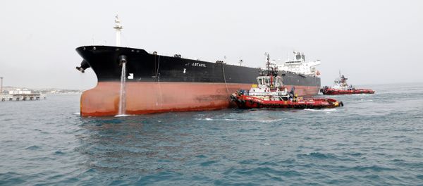 A picture taken on March 12, 2017, shows an Iranian tanker docking at the platform of the oil facility in the Khark Island, on the shore of the Gulf - Sputnik International