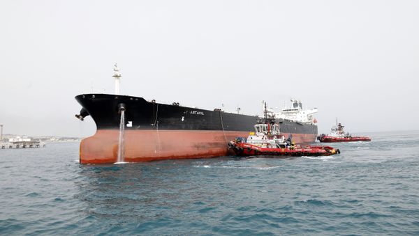 A picture taken on March 12, 2017, shows an Iranian tanker docking at the platform of the oil facility in the Khark Island, on the shore of the Gulf A picture taken on March 12, 2017, shows an Iranian tanker docking at the platform of the oil facility in the Khark Island, on the shore of the Gulf - Sputnik International