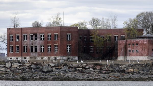 In this April 29, 2018 photo, small pipes sticking up from the ground mark some of the mass graves on Hart Island in New York - Sputnik International