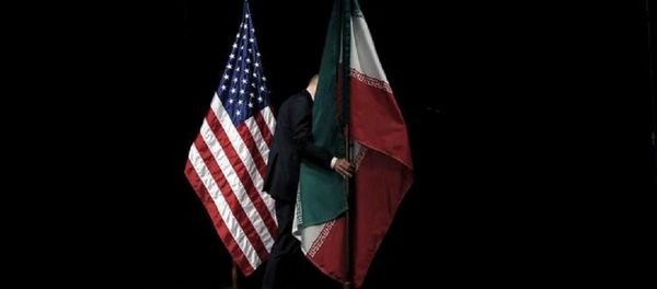 A staff member removes the Iranian flag from the stage after a group picture with foreign ministers and representatives of the U.S., Iran, China, Russia, Britain, Germany, France and the European Union during the Iran nuclear talks at the Vienna International Center in Vienna, Austria July 14, 2015 A staff member removes the Iranian flag from the stage after a group picture with foreign ministers and representatives of the U.S., Iran, China, Russia, Britain, Germany, France and the European Union during the Iran nuclear talks at the Vienna International Center in Vienna, Austria July 14, 2015 - Sputnik International