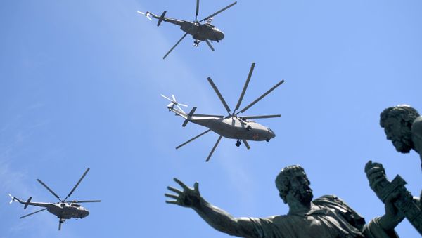 The heavy transport Mi-26 helicopter and the multi-purpose Mi-8AMTSh helicopters on the military parade devoted to the 73rd anniversary of the victory in the Great Patriotic War of 1941-1945 - Sputnik International