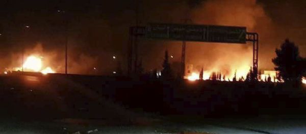 This photo released on Wednesday, May 9, 2018, by the Syrian official news agency SANA, shows flames rising after an attack in an area known to have numerous Syrian army military bases, in Kisweh, south of Damascus, Syria - Sputnik International