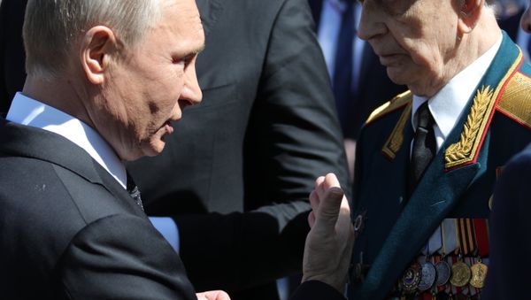 May 9, 2018. President of Russia and the Supreme Commander-in-Chief of the Russian Armed Forces Vladimir Putin with a veteran after the military parade to mark the 73rd anniversary of Victory in the Great Patriotic War of 1941-1945 on Moscow's Red Square. President of Serbia Aleksandar Vucic, background May 9, 2018. President of Russia and the Supreme Commander-in-Chief of the Russian Armed Forces Vladimir Putin with a veteran after the military parade to mark the 73rd anniversary of Victory in the Great Patriotic War of 1941-1945 on Moscow's Red Square. President of Serbia Aleksandar Vucic, background - Sputnik International