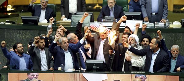 Iranian lawmakers set fire on JCPOA, US flag after Trump’s exit from Iran deal Iranian lawmakers set fire on JCPOA, US flag after Trump’s exit from Iran deal - Sputnik International