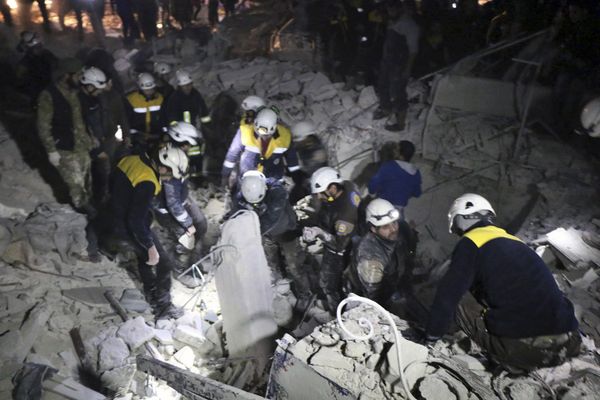 This photo provided on Sunday, Jan. 7, 2018 by the Syrian Civil Defense White Helmets, which has been authenticated based on its contents and other AP reporting, shows Civil Defense workers inspecting a damages building after a bombing that targeted the office of Ajnad al-Koukaz, a militant group consisting of foreign fighters mostly from the Caucuses and Russia, in Idlib, Syria This photo provided on Sunday, Jan. 7, 2018 by the Syrian Civil Defense White Helmets, which has been authenticated based on its contents and other AP reporting, shows Civil Defense workers inspecting a damages building after a bombing that targeted the office of Ajnad al-Koukaz, a militant group consisting of foreign fighters mostly from the Caucuses and Russia, in Idlib, Syria - Sputnik International
