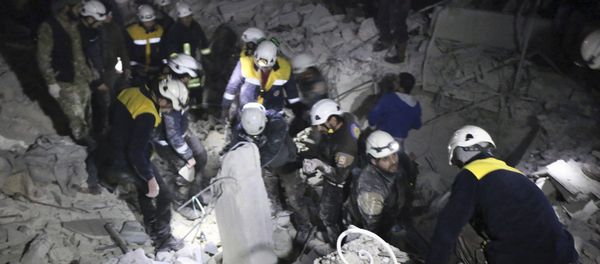 This photo provided on Sunday, Jan. 7, 2018 by the Syrian Civil Defense White Helmets, which has been authenticated based on its contents and other AP reporting, shows Civil Defense workers inspecting a damages building after a bombing that targeted the office of Ajnad al-Koukaz, a militant group consisting of foreign fighters mostly from the Caucuses and Russia, in Idlib, Syria This photo provided on Sunday, Jan. 7, 2018 by the Syrian Civil Defense White Helmets, which has been authenticated based on its contents and other AP reporting, shows Civil Defense workers inspecting a damages building after a bombing that targeted the office of Ajnad al-Koukaz, a militant group consisting of foreign fighters mostly from the Caucuses and Russia, in Idlib, Syria - Sputnik International