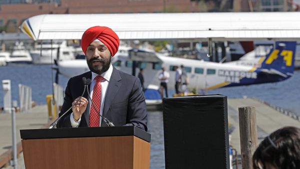 Navdeep Bains, Canada's Minister of Innovation, Science and Economic Development, speaks Wednesday, April 25, 2018, on Lake Union in Seattle at a news conference announcing that a partnership between Harbour Air and Kenmore Air will start offering direct one-hour seaplane flights between downtown Seattle and Vancouver, British Columbia, beginning Thursday - Sputnik International