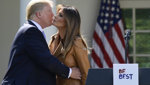 President Donald Trump kisses first lady Melania Trump following an event where Melania Trump announced her initiatives in the Rose Garden of the White House in Washington, Monday, May 7, 2018 President Donald Trump kisses first lady Melania Trump following an event where Melania Trump announced her initiatives in the Rose Garden of the White House in Washington, Monday, May 7, 2018 - Sputnik International