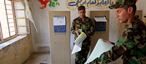 Iraqi soldiers prepare to cast their votes in early voting for Iraq's security forces, prisoners and hospital patients ahead of Saturday's national parliamentary elections, in Baghdad, Iraq, Thursday, May 10, 2018. Iraqi soldiers prepare to cast their votes in early voting for Iraq's security forces, prisoners and hospital patients ahead of Saturday's national parliamentary elections, in Baghdad, Iraq, Thursday, May 10, 2018. - Sputnik International