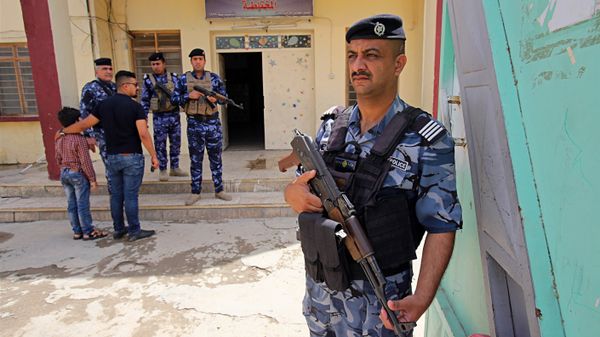In this Wednesday, May 9, 2018 photo, Iraqi security forces guard a polling station in Baghdad, Iraq In this Wednesday, May 9, 2018 photo, Iraqi security forces guard a polling station in Baghdad, Iraq - Sputnik International