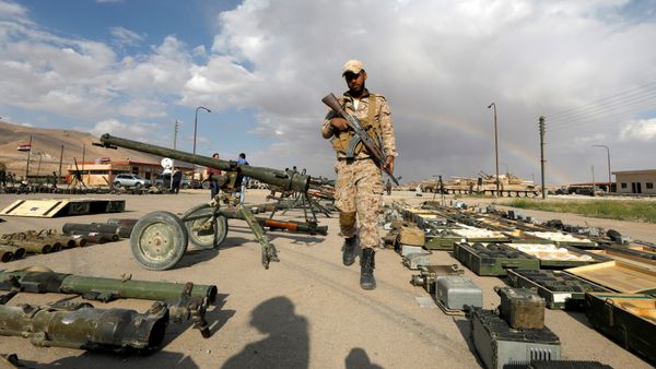 (File) A Syrian Army soldier holds his weapon, as he walks next to others that belonged to rebels from Eastern Qalamoun, after they handed them over, at the town of Dumayr, Damascus, Syria April 22, 2018 - Sputnik International